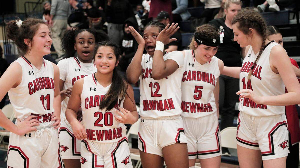 Cardinal Newman players celebrate defeating First Baptist in the SCISA tournament at the Sumter Civic Center on Saturday, February 26, 2022.