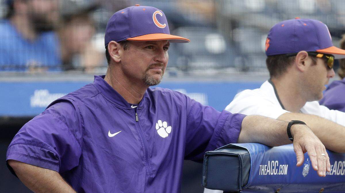 Clemson coach Monte Lee watches from the dugout during the second inning of an Atlantic Coast Conference NCAA college baseball tournament semifinal against Florida State in Durham, N.C., Saturday, May 26, 2018. (AP Photo/Gerry Broome)