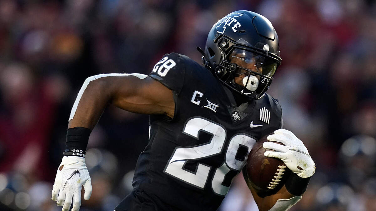 Iowa State running back Breece Hall (28) carries the ball up field during the first half an NCAA college football game against TCU, Friday, Nov. 26, 2021, in Ames, Iowa. (AP Photo/Charlie Neibergall)