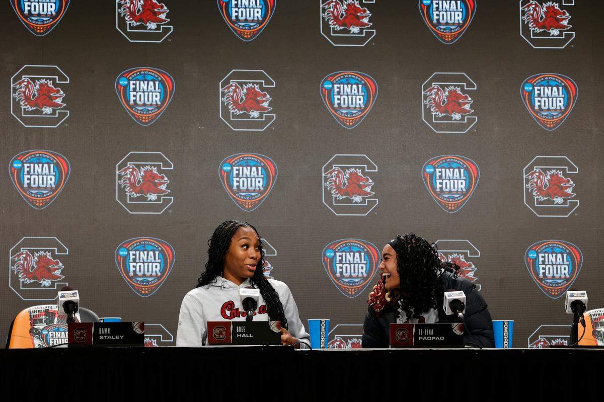 South Carolina’s Bree Hall and Te-Hina Paopao laugh before a press conference in advance of the Final Four game at Mortgage Field House in Cleveland, Ohio on Thursday, April 4, 2024.