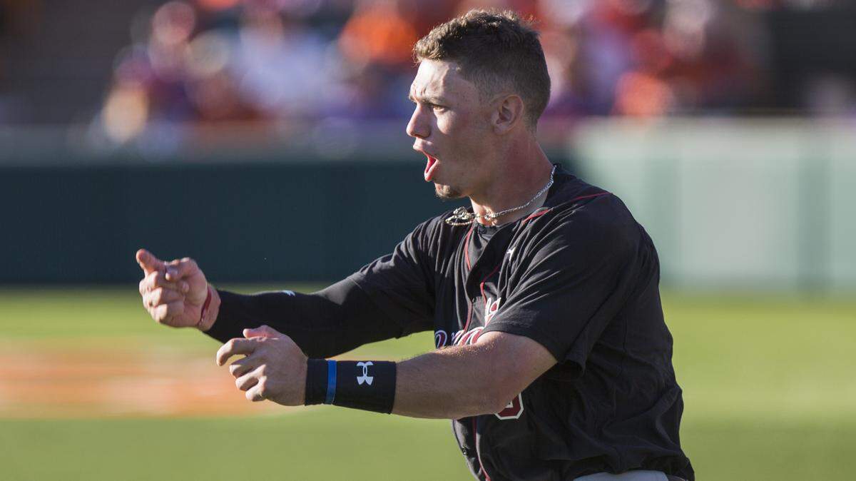 South Carolina outfielder TJ Hopkins (5) cheers on his team during the game against Clemson at Doug Kingsmore Stadium on March 4, 2018, in Clemson, S.C.