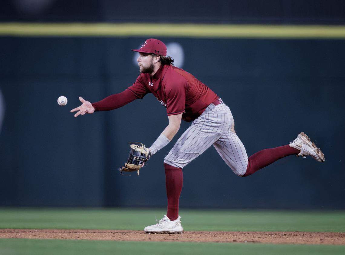 Gamecock 2nd baseman Parker Noland (11) grabs the ground ball and makes the double play. North Carolina and South Carolina would play at Truist Field on April 9, 2024.
