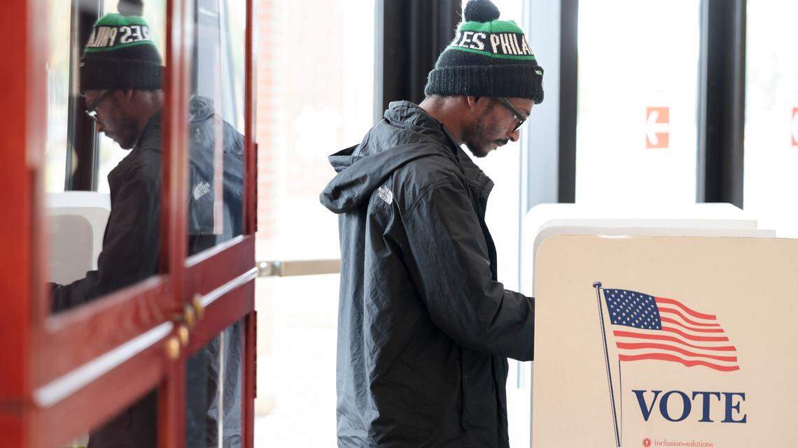A voter casts his ballot on Tuesday at Lower Richland High School in the Richland 1 school district.
