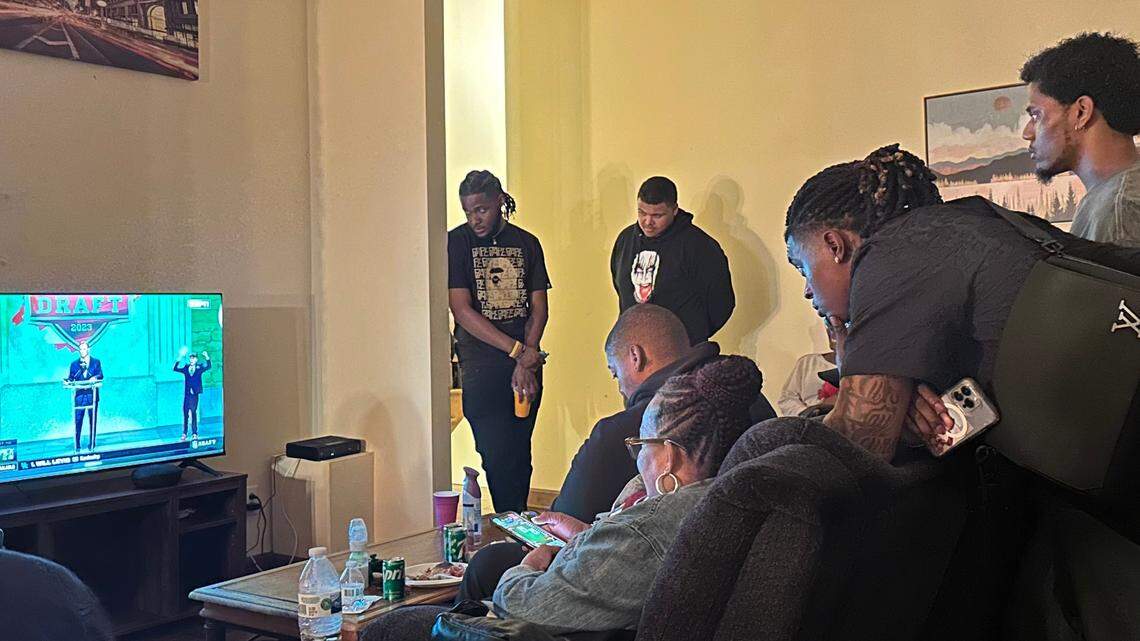 South Carolina cornerback Cam Smith leans over the couch at a house in Charlotte during the first round of the NFL Draft on Thursday night.