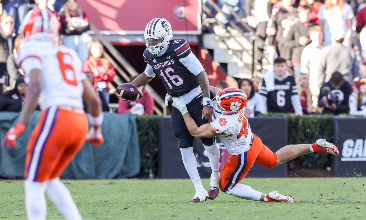 South Carolina quarterback Lanorris Sellers (16) is chased down by Clemson linebacker Sammy Brown (47) during the second half of South Carolina’s game against Clemson at Williams-Brice Stadium in Columbia on Saturday, November 29, 2025.
