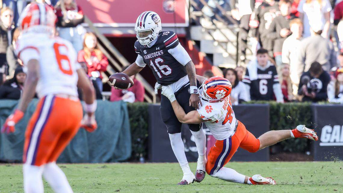 Clemson linebacker Sammy Brown (47) tackles South Carolina quarterback LaNorris Sellers (16) during the Tigers’ 2025 win against the Gamecocks in Columbia.