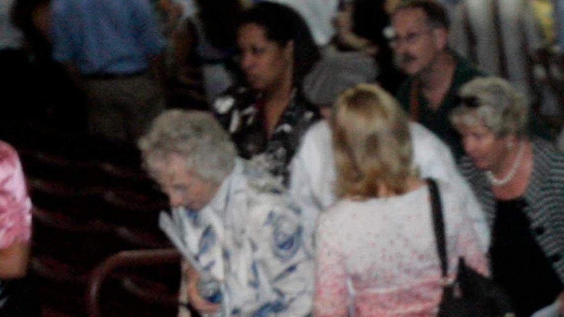 USC senior wide receiver Moe Brown hugs family members after participating in Friday's commencement ceremony at the Colonial Life Arena, May 7, 2010