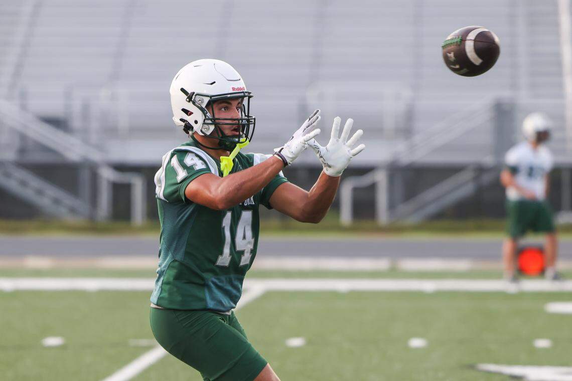 Dutch Fork wide receiver Stone Furrey (14) runs drills during practice at Dutch Fork in Irmo on Thursday, July 31, 2025.