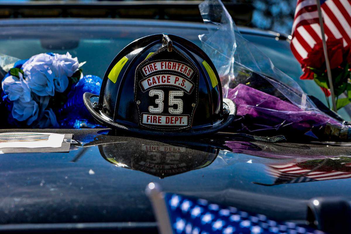 The patrol car of Roy Andrew “Drew” Barr, is set up as a memorial to the 28-year-old Cayce Police officer who was shot and killed during a domestic call on Sunday, April, 24, 2022.