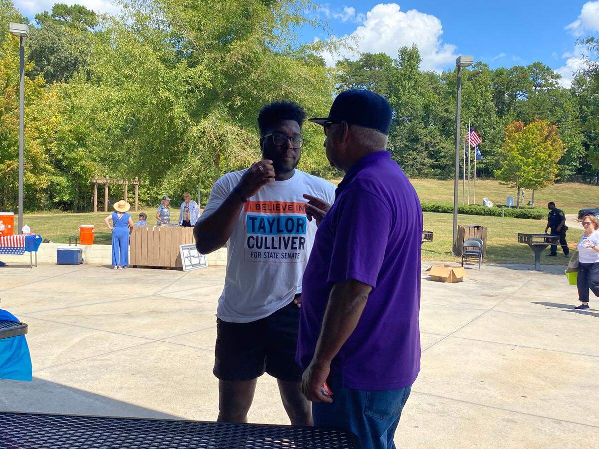 State Senate District 8 Democratic nominee Taylor Culliver speaks to a supporter during the Greenville County Democratic Party Candidate Cookout on Saturday, Sept. 7, 2024.