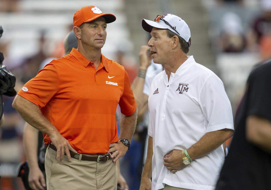Clemson coach Dabo Swinney (left) and Texas A&M coach Jimbo Fisher