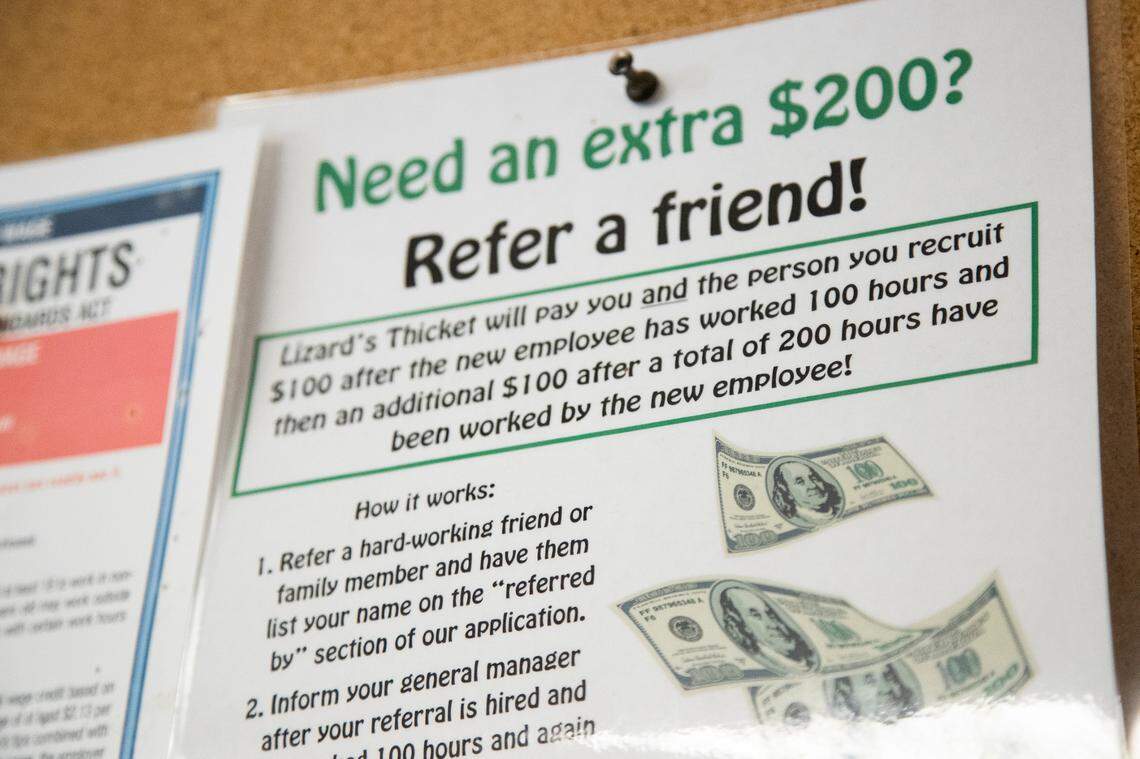 A sign telling employees about a referral program at The Lizard Thicket on Friday, August 27, 2021. Operations manager Matthew Williams says it’s hard to tell how many employees will receive the bonus.