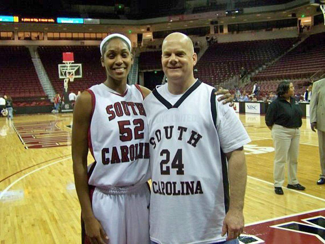 Today, South Carolina’s fans are affectionately referred to as “FAMS.” Visiting and taking photos with them is a big part of USC’s postgame routine. When fewer fans frequented South Carolina women’s basketball games at the beginning of Staley’s tenure, the Gamecocks referred to them as “Day 1s.” “That’s Dave” on the right, Jewel May (left) said, “one of the Day 1s! He used to take tons of pics at all the games and tag us in them so we have him to thank for so many memories captured.”