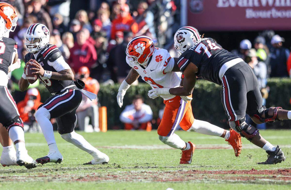 Clemson defensive end T.J. Parker (3) rushes South Carolina quarterback LaNorris Sellers (16) during South Carolina’s game against Clemson at Williams-Brice Stadium in Columbia on Saturday, November 29, 2025.