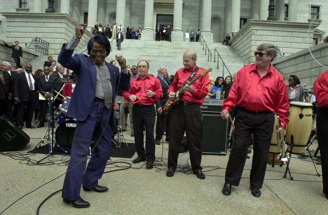 James Brown dances with the group the Sensational Epics while they perform Brown's hit song "I Feel Good" on the north steps of the South Carolina state house on April 10, 2002. Gov. Jim Hodges declared Brown South Carolina’s “Godfather of Soul.”