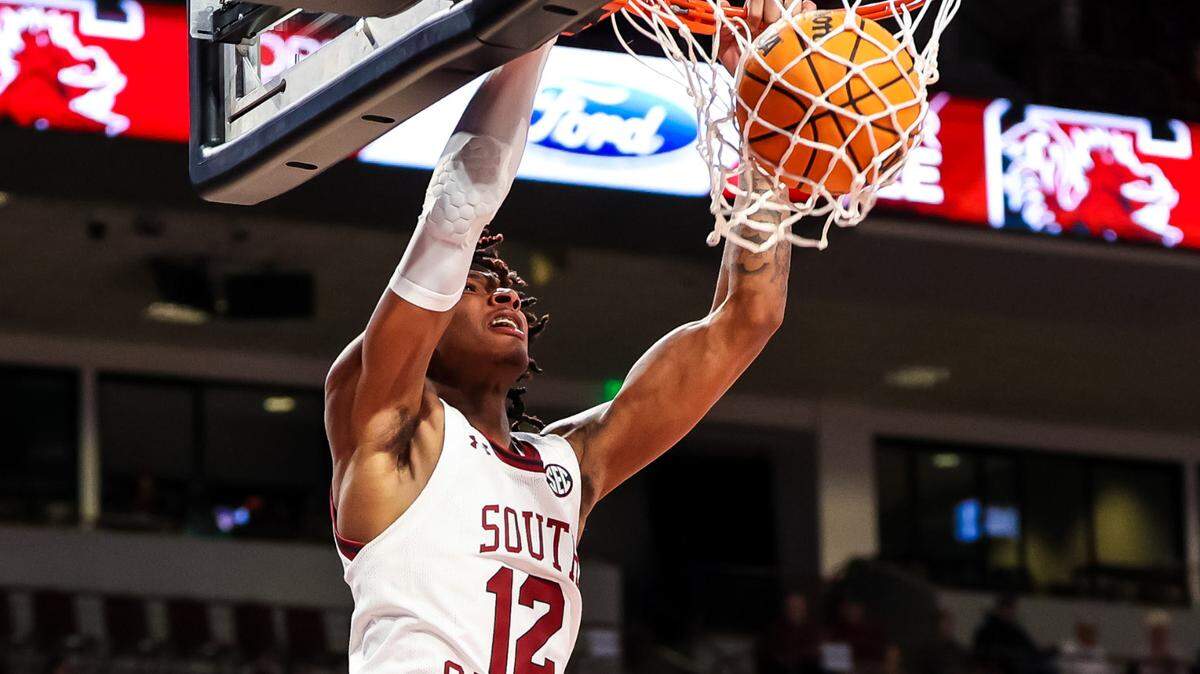 Mar 4, 2023; Columbia, South Carolina, USA; South Carolina Gamecocks guard Zachary Davis (12) dunks against the Georgia Bulldogs in the first half at Colonial Life Arena. Mandatory Credit: Jeff Blake-USA TODAY Sports