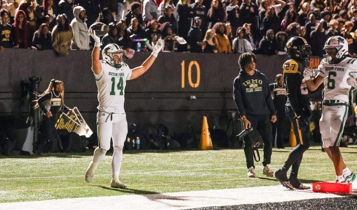Stone Furrey (14) of Dutch Fork celebrates a touchdown during Irmo’s game against visiting Dutch Fork in Columbia on Friday, October 31, 2025.