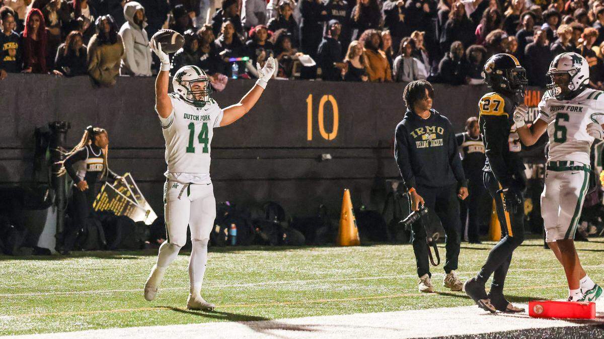Stone Furrey (14) of Dutch Fork celebrates a touchdown during Irmo’s game against visiting Dutch Fork in Columbia on Friday, October 31, 2025.