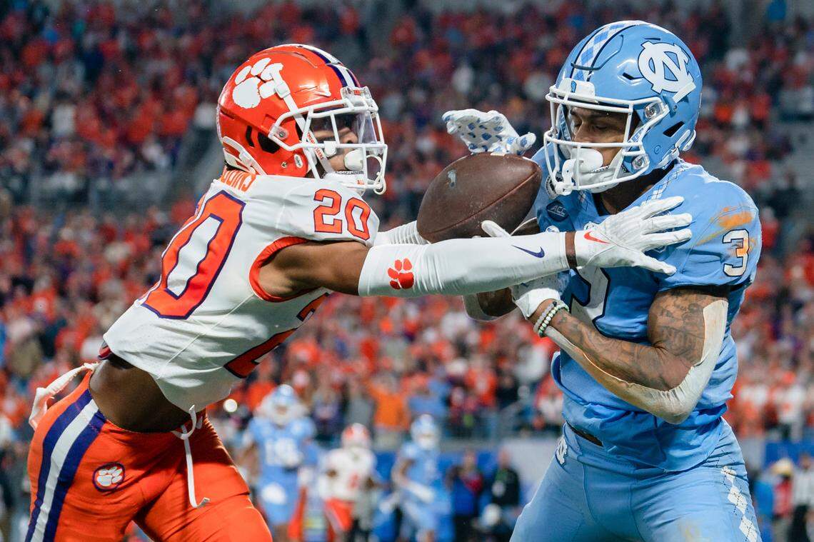 Clemson cornerback Nate Wiggins (20) breaks up a pass intended for North Carolina wide receiver Antoine Green (3) in the end zone in the first half during the Atlantic Coast Conference championship NCAA college football game on Saturday, Dec. 3, 2022, in Charlotte, N.C. (AP Photo/Jacob Kupferman)