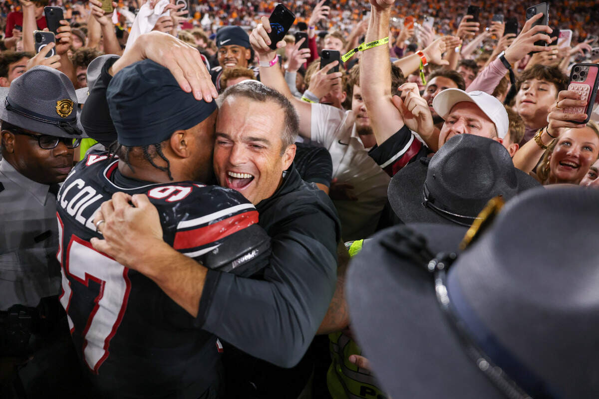 South Carolina head coach Shane Beamer celebrates with linebacker Kelby Collins (97) after the Gamecocks' win against Tennessee in Columbia, Saturday, Oct. 24, 2026.