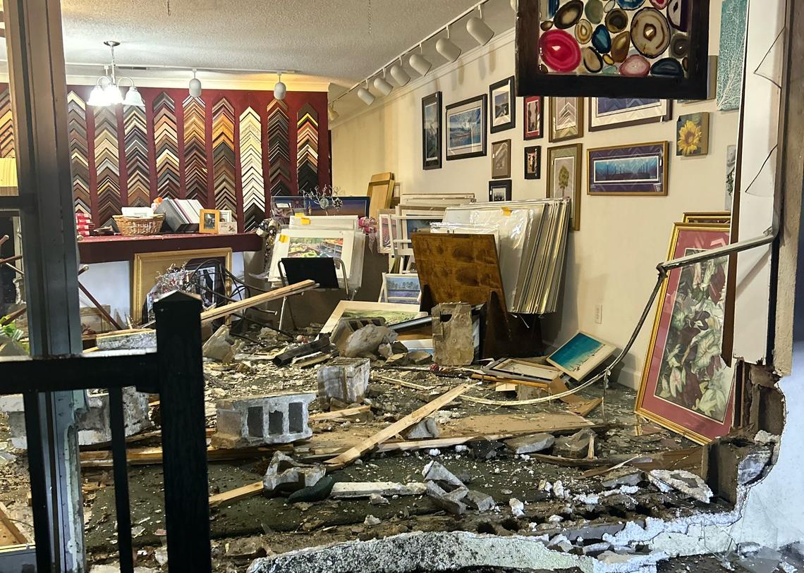 A car crashed into a retail business building.