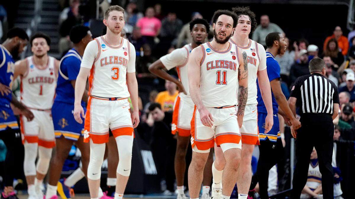 Mar 20, 2025; Providence, RI, USA; Clemson Tigers guard Jake Heidbreder (3) and guard Jaeden Zackery (11) and forward Ian Schieffelin (4) walk to the Tigers bench during the second half against the McNeese State Cowboys at Amica Mutual Pavilion.