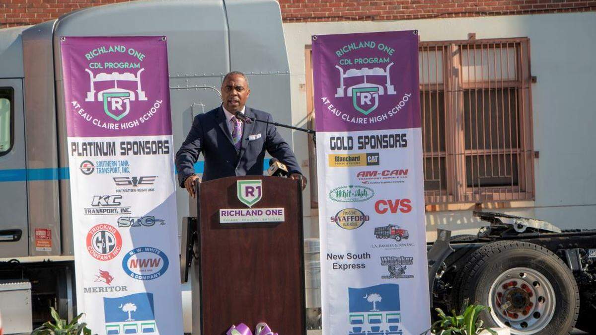 Richland 1 School Board chairman Jamie Devine speaks during a May 16 ribbon-cutting of a program that aims to help Eau Claire High School students get Commercial Driver’s Licenses