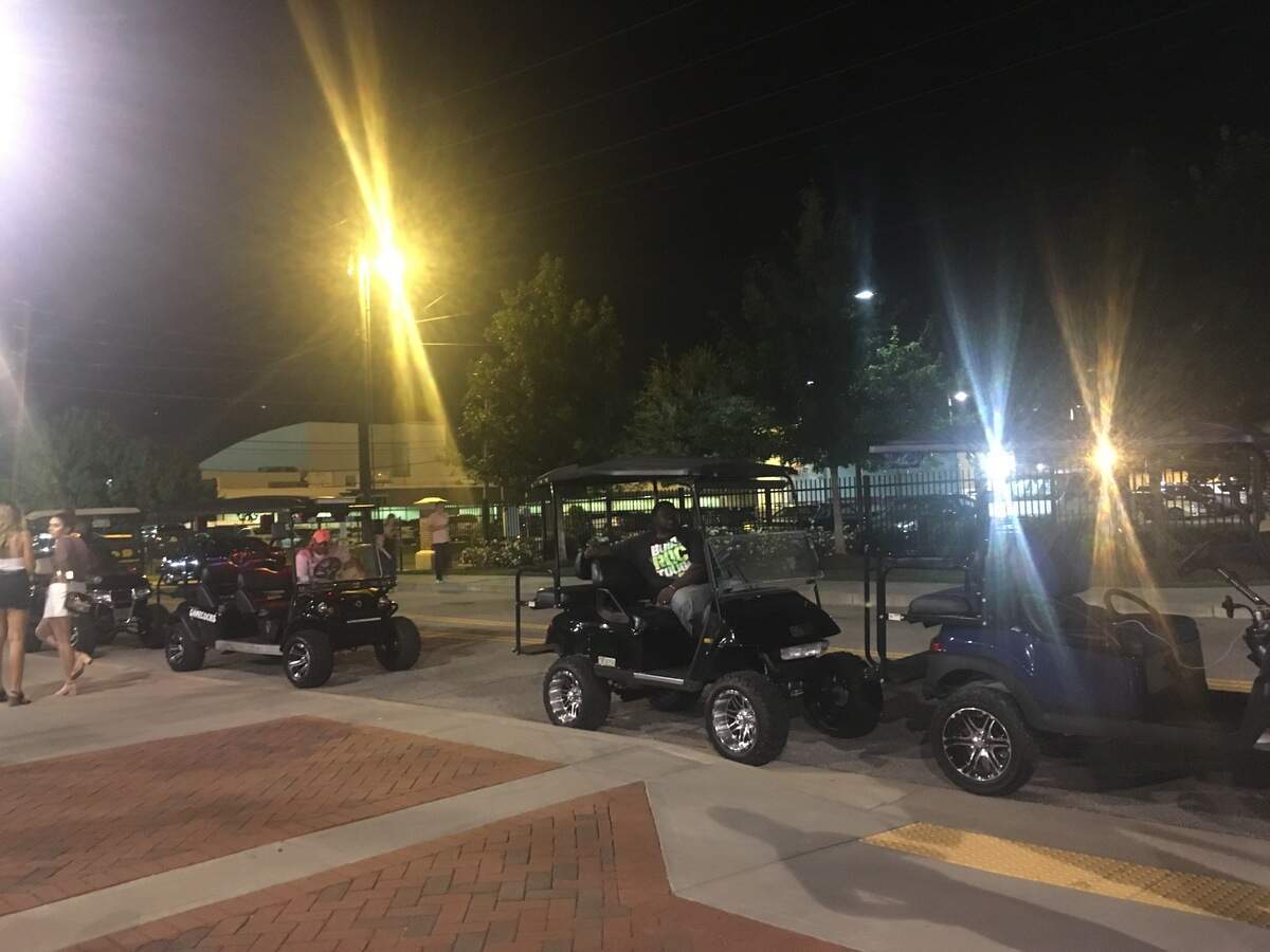 Golf carts wait for patrons along Key Road next to Williams-Brice Stadium during the Beyonce and Jay-Z On the Run II tour stop in Columbia.