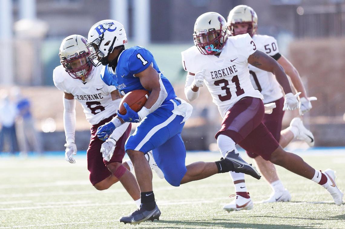 Barton Bulldogs running back Jordan Terrell (1) tries to get away from Erskine Flying Fleet defenders in the third quarter.