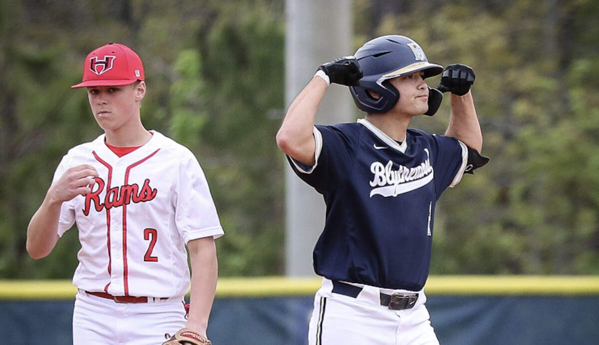 Blythewood’s Alex Nevils, right, flexes after hitting a double against Hillcrest during the 2022 SC Diamond Invitational.