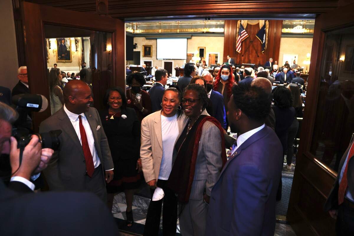 S.C. House Rep. Gilda Cobb-Hunter, D-Orangeburg, right, poses for a picture with University of South Carolina women’s basketball head coach Dawn Staley in the House antechamber on Wednesday, April 6, 2022.