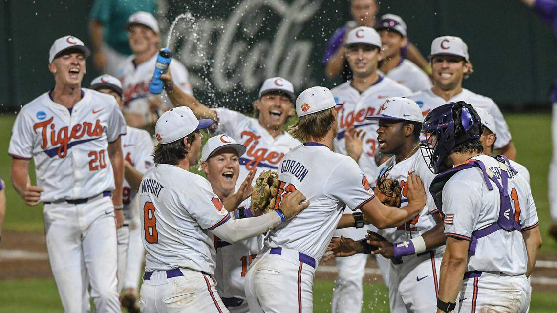 Jun 2, 2024; Clemson, South Carolina, USA; Clemson junior Austin Gordon (56) reacts with catcher Jimmy Obertop (11) after helping beat Coastal Carolina University at the NCAA baseball Clemson Regional at Doug Kingsmore Stadium in Clemson.