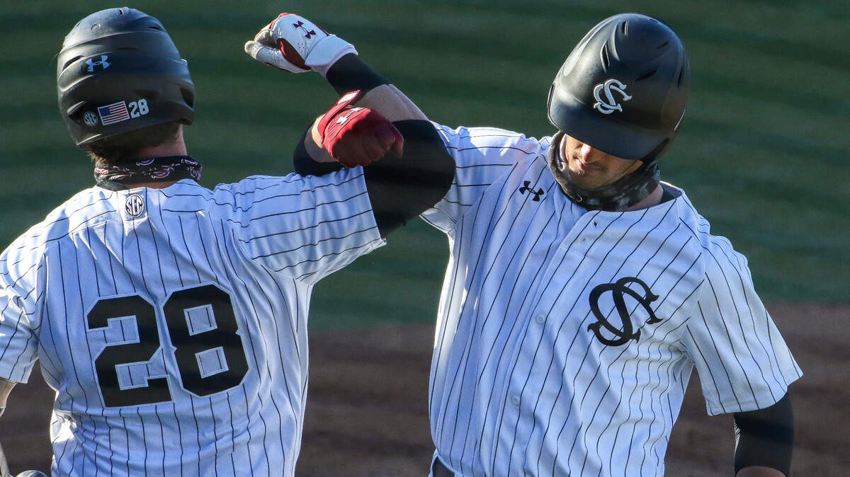 South Carolina baseball’s Josiah Sightler, right, celebrates with a teammate against Mercer on March 6, 2021.