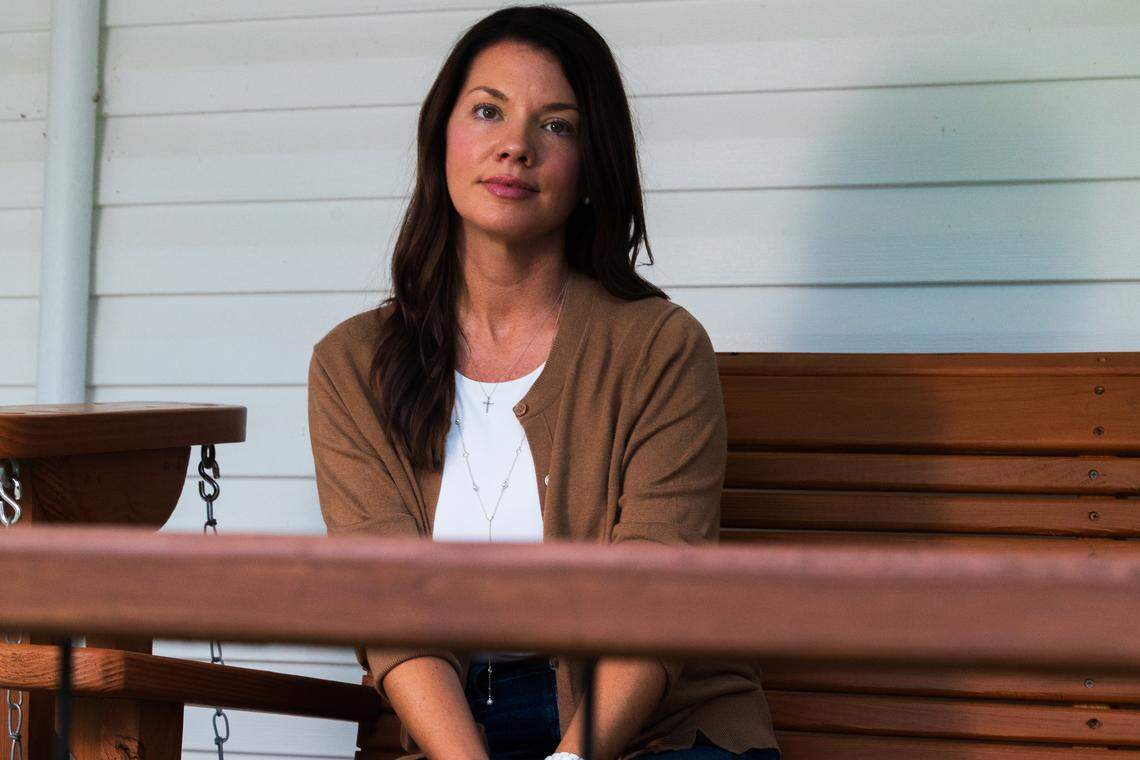 Rose Anna Welch sits on a porch swing made by Ben Case.