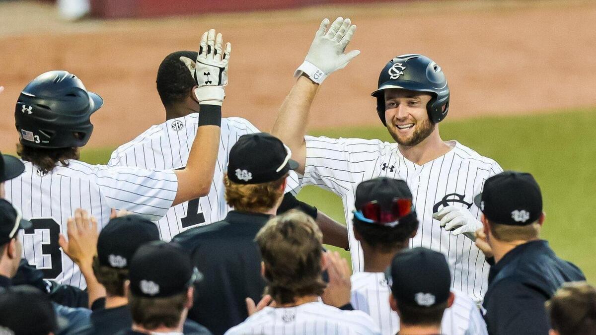 South Carolina Gamecocks outfielder Andrew Eyster (11) celebrates hitting a three-run homer against the Vanderbilt Commodores during their game at Founders Park Friday, March 25, 2022.