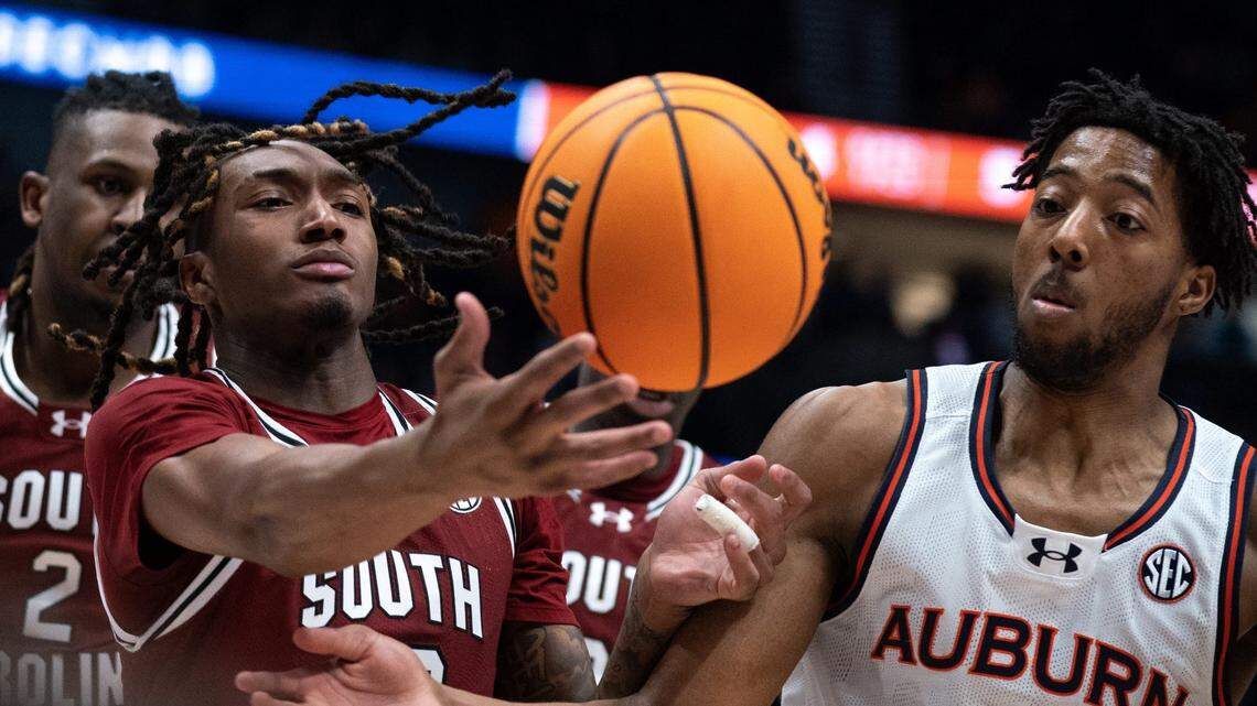 South Carolina Gamecocks guard Zachary Davis (12) and Auburn Tigers guard Chaney Johnson (31) go for a rebound during their SEC Men’s Basketball Tournament quarterfinal game at Bridgestone Arena in Nashville, Tenn., Friday, March 15, 2024.at Bridgestone Arena in Nashville, Tenn., Friday, March 15, 2024.