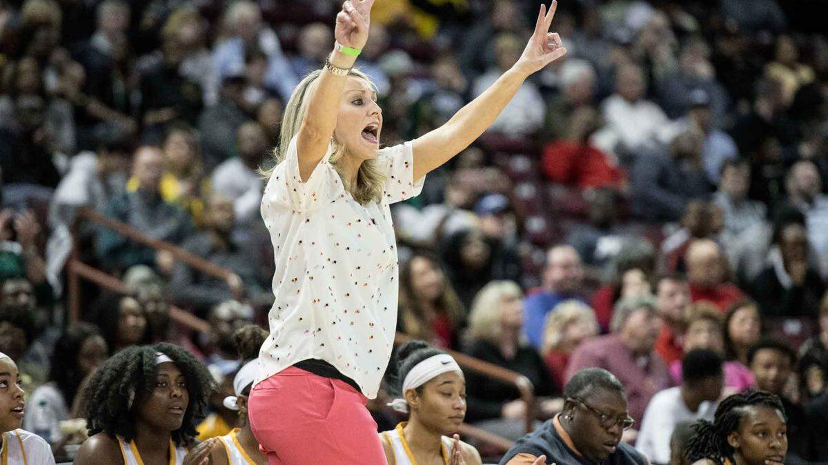 Spring Valley coach Megan Assey communicates with players during the Class 5A Girls state championship game at Colonial Life Arena March 2, 2018, in Columbia, S.C. Spring Valley defeated Wade Hampton 49-37.