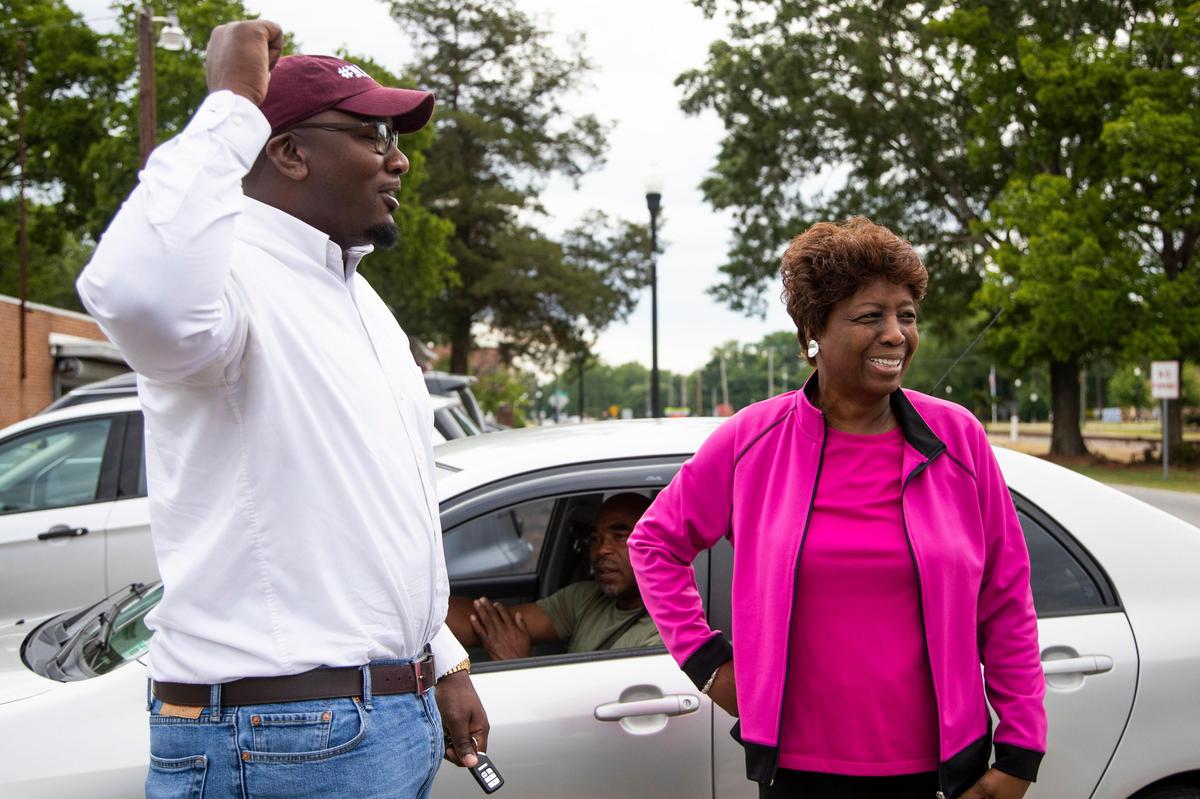 Dr. Jermaine Johnson speaks with Geraldine Robinson, the mayor of Eastover, South Carolina on Friday May 8, 2020. He is running for South Carolina House District 80’s seat and has had to modify his campaign greatly to protect himself and others from the coronavirus.