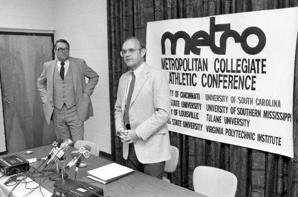 April 14, 1983: USC announces its entry into the Metro Conference: University of South Carolina athletic director Bob Marcum announces that the Gamecocks will join the Metropolitan Collegiate Athletic Conference at a USC Board of Trustees meeting. Metro Conference commissioner Jerry Lovelace stands by.