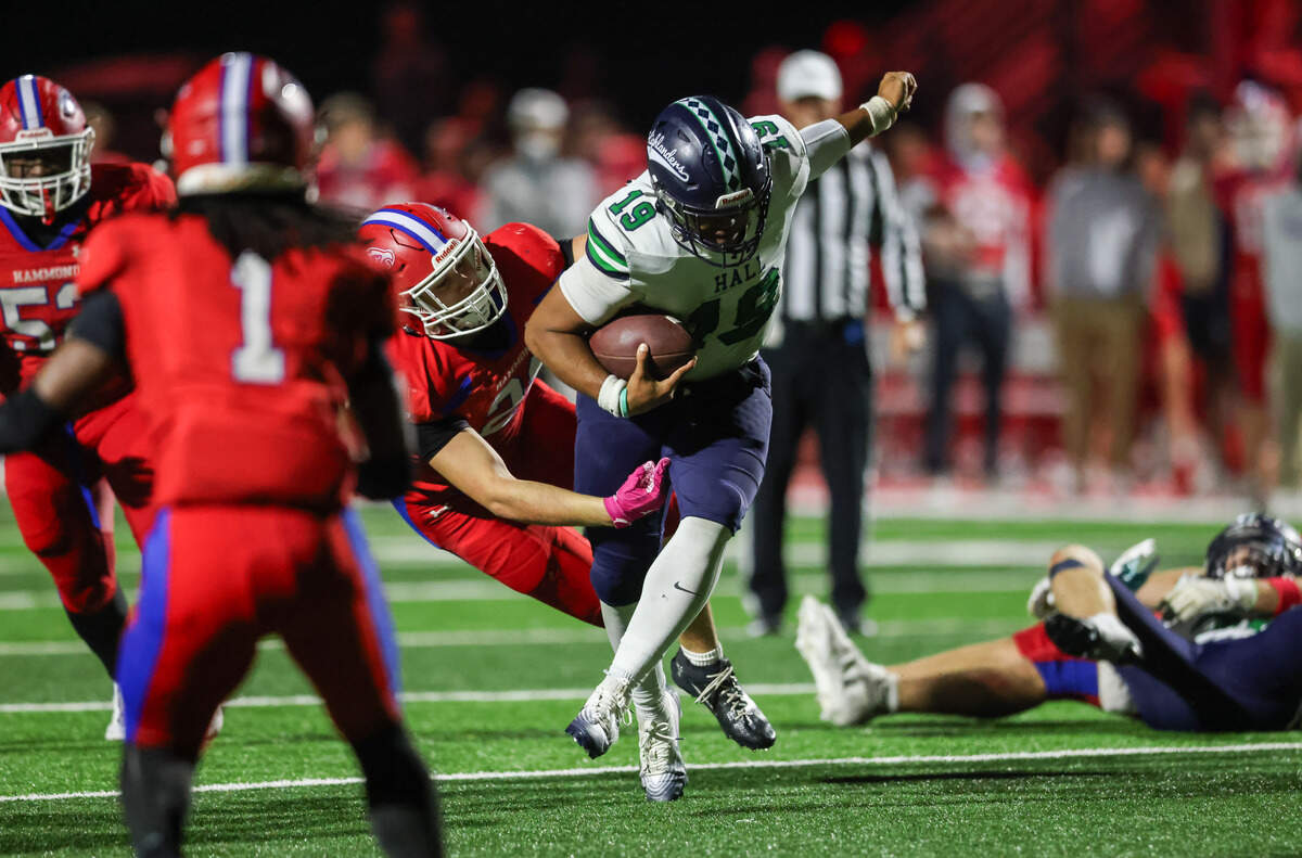 Patrick Belk (19) of Heathwood Hall carries the ball during Hammond’s game against Heathwood Hall at Hammond on Friday, Nov. 14, 2025.