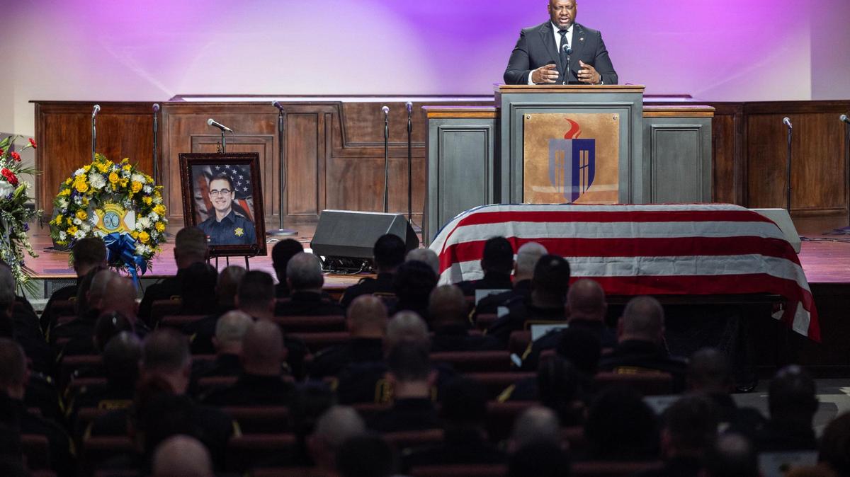 Richland County Sheriff’s Department Dr. Aaron Bishop speaks during a funeral for Deputy Jacob Salrin on Thursday, October 5, 2023