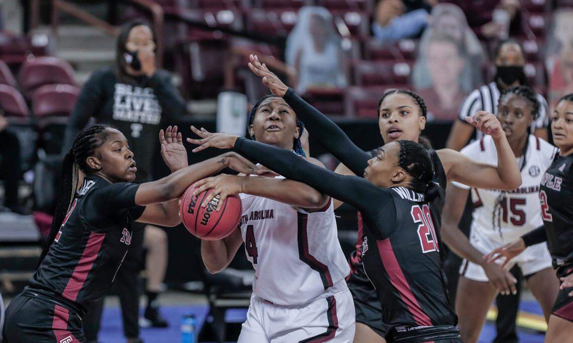 South Carolina Gamecocks forward Aliyah Boston (4) is pressured by Temple guard Asonah Alexander (2) and Temple forward Alexa Williamson (20) during the first half of action at the Colonial Life Arena.