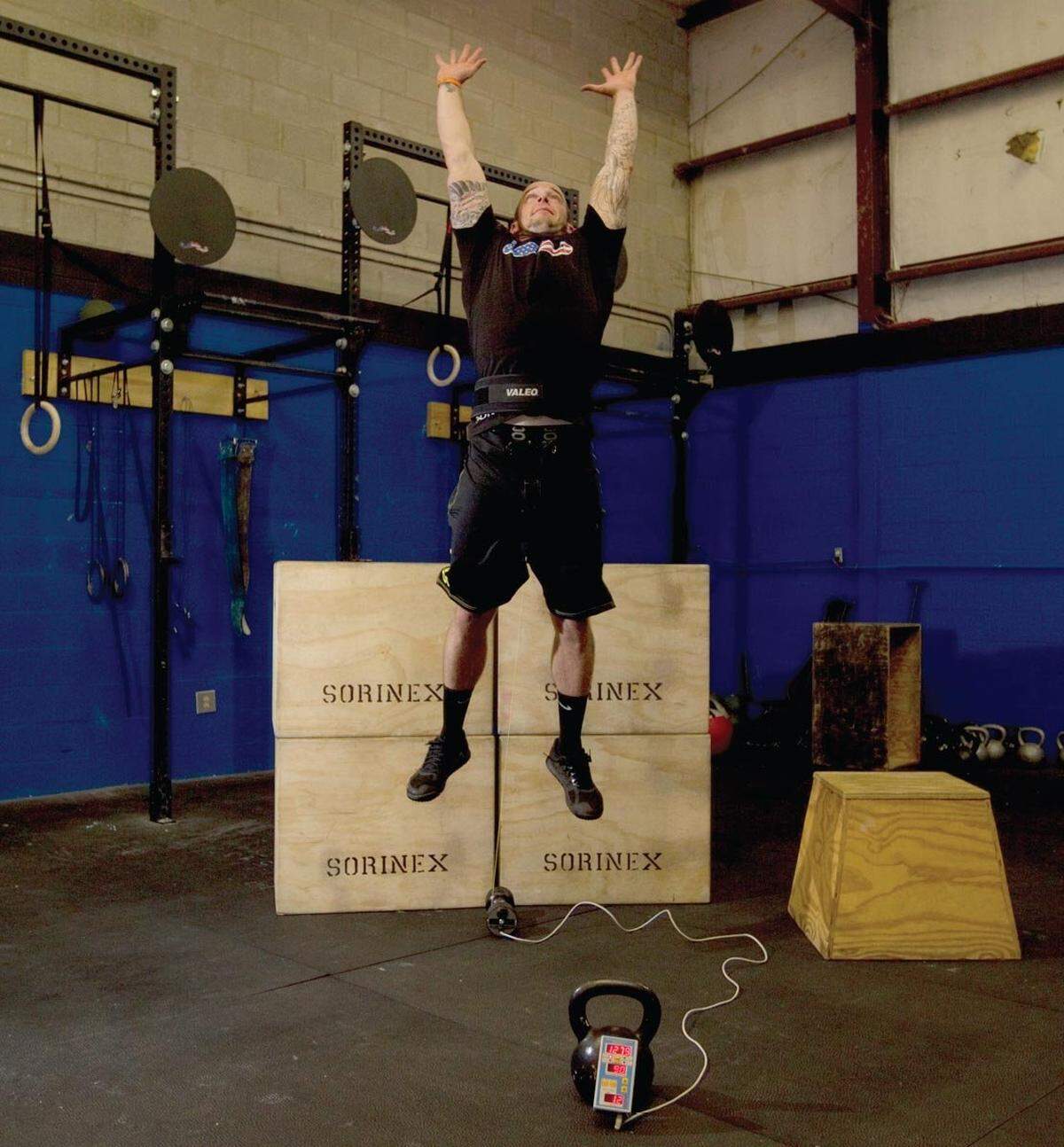 In this file photo, Dustin Riddle demonstrates the measuring ability of a Tendo machine while performing a vertical jump. Sorinex, which is located in Columbia, is the North American distributor of the Tendo. The device is like a stopwatch in the barbell world.