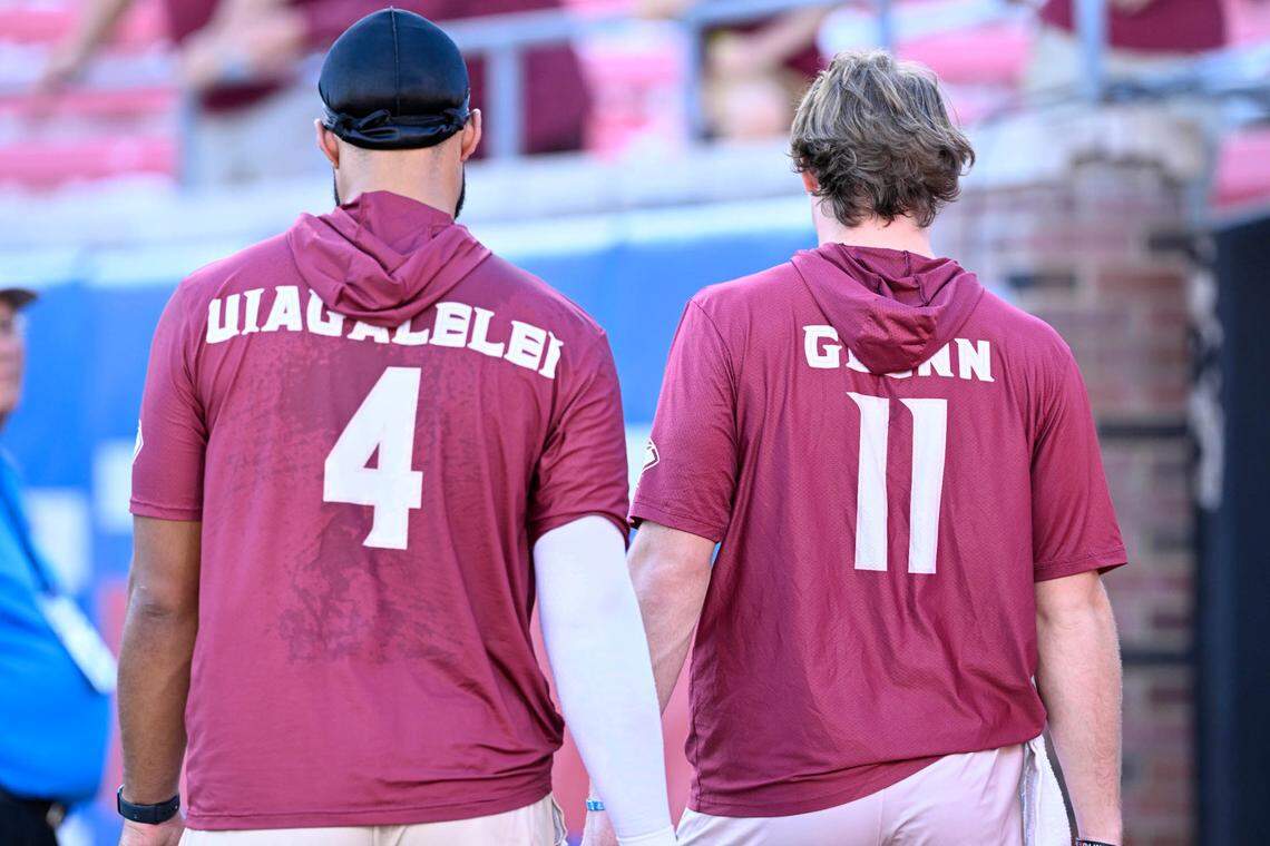 Sep 28, 2024; Dallas, Texas, USA; Florida State Seminoles quarterback DJ Uiagalelei (4) and quarterback Brock Glenn (11) before the game between the Southern Methodist Mustangs and the Florida State Seminoles at Gerald J. Ford Stadium.