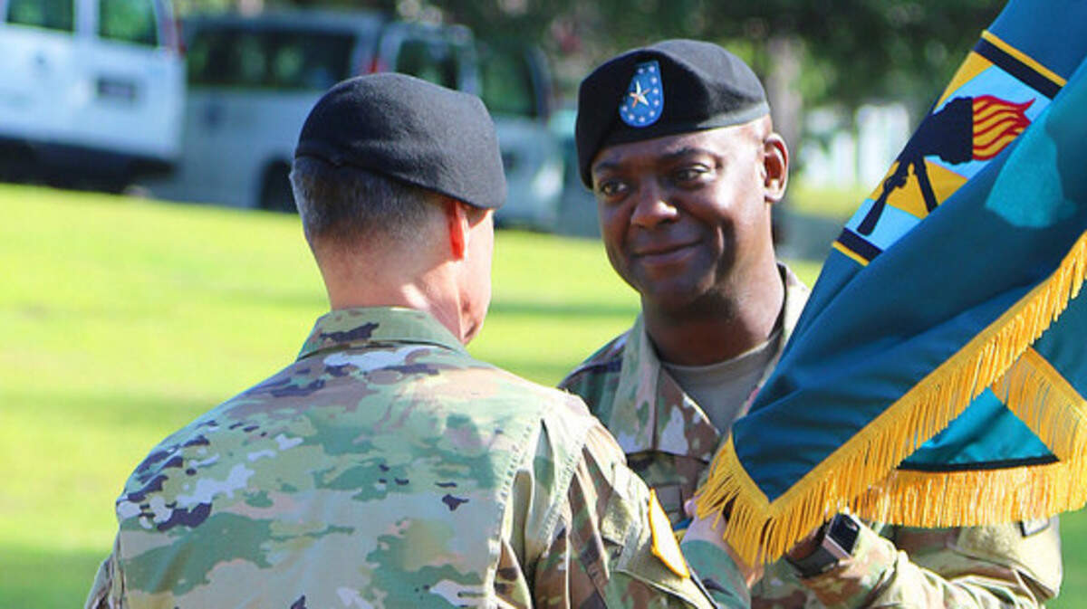 Brig. Gen. Milford 'Beags' Beagle Jr., Fort Jackson and Army Training Center commander, receives the unit colors from Maj. Gen. Malcolm Frost, commander of the Center for Initial Military Training, on Friday during a change of command ceremony at Victory Field on Fort Jackson.