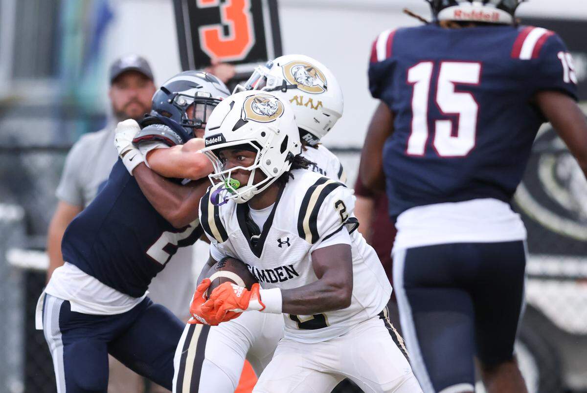 Tylin Drakeford (2) of Camden carries the ball during White Knoll’s game against Camden in Lexington on Thursday, August 21, 2025.