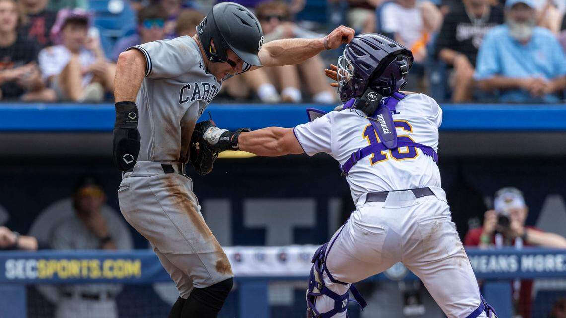 LSU catcher Brady Neal (16) tags South Carolina outfielder Blake Jackson (6) out on an attempt to steal home in the 10th inning during the SEC Baseball Tournament at Hoover Metropolitan Stadium. Umpires reversed the call, declaring catcher interference and giving USC the go-ahead run at the time.