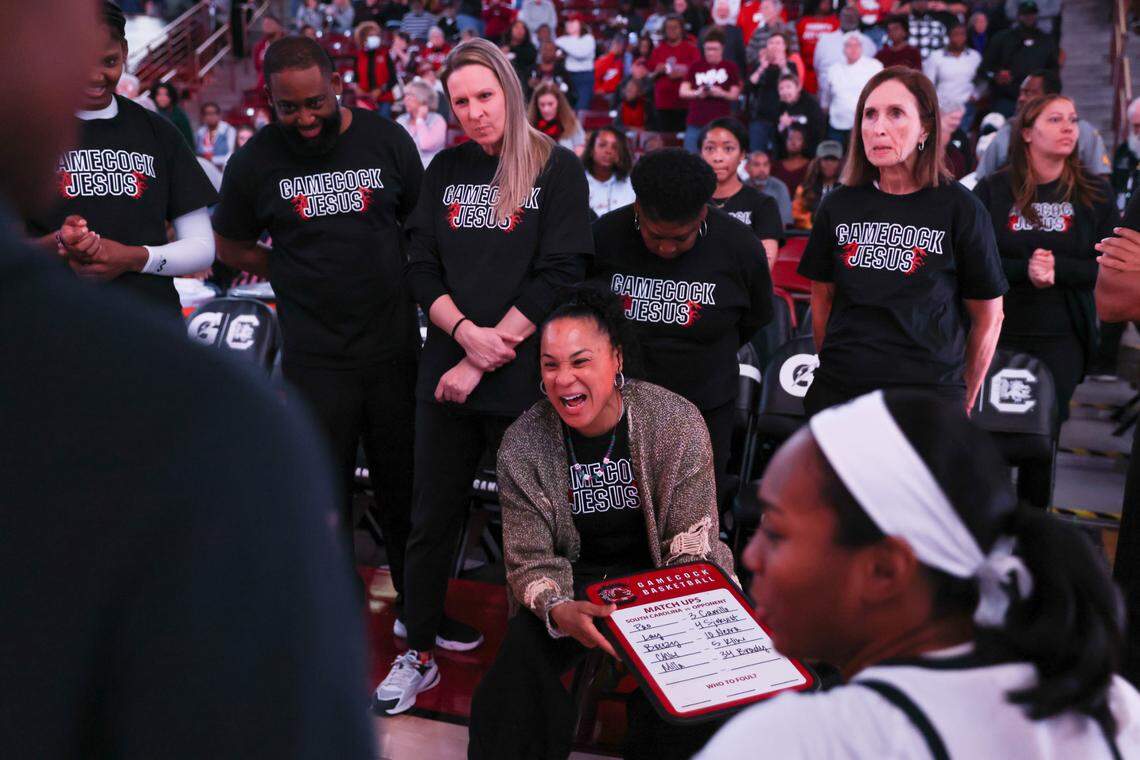 South Carolina head coach Dawn Staley laughs with her team before the Gamecocks’ game at Colonial Life Arena in Columbia on Saturday, December 16, 2023.