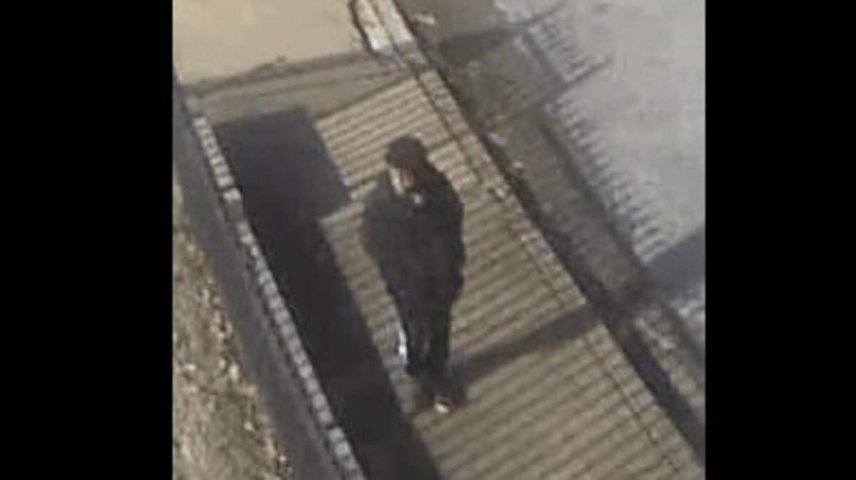 A surveillance photo shows a suspect in a Christmas Day robbery that occurred at a cemetery.