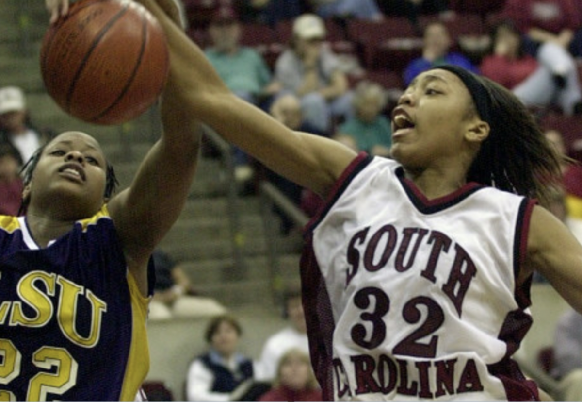 USC guard Shaunzinski Gortman snags a rebound from LSU forward April Brown at Frank McGuire Arena on Sunday Feb. 25, 2001. (The State Newspaper Archives)